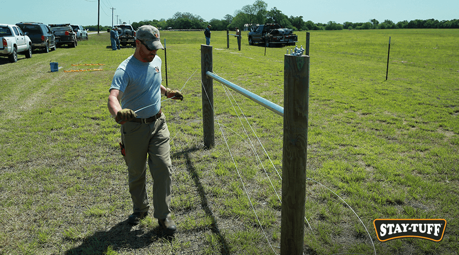 A guide wire aids in setting line posts and makes installation easier